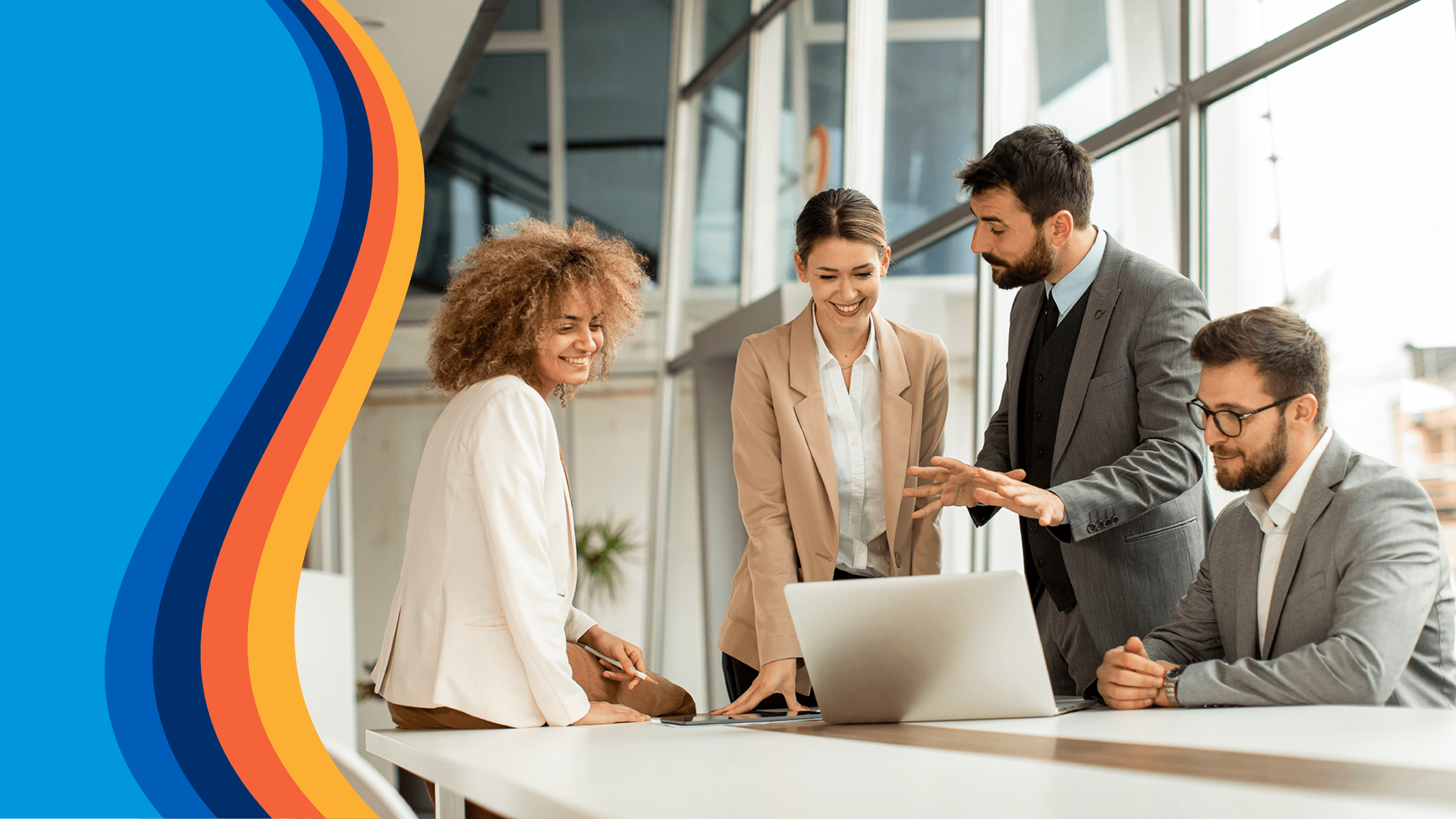 a group of people are looking at a laptop together
