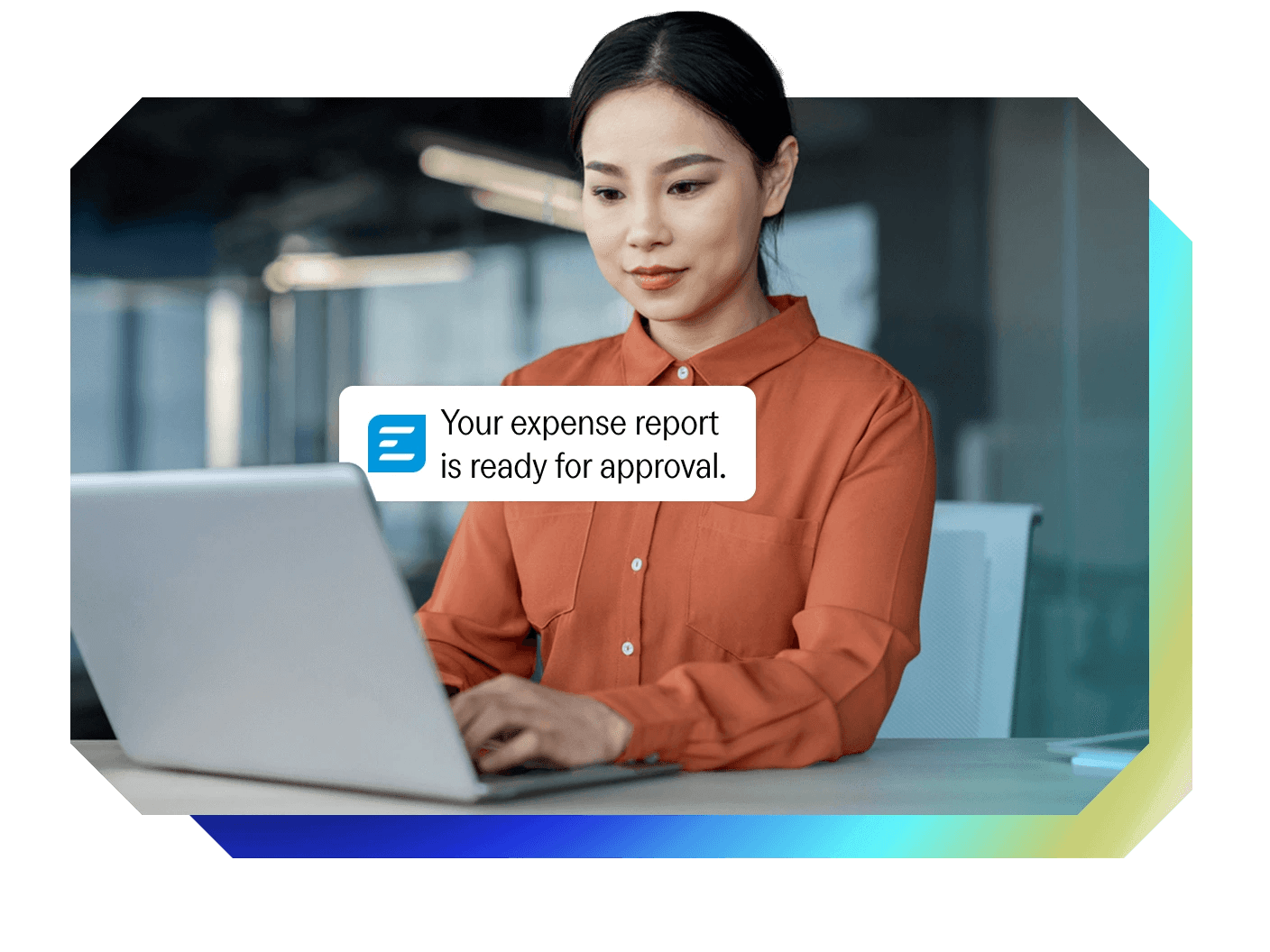 a woman is typing on a laptop with a message that says your expense report is ready for approval