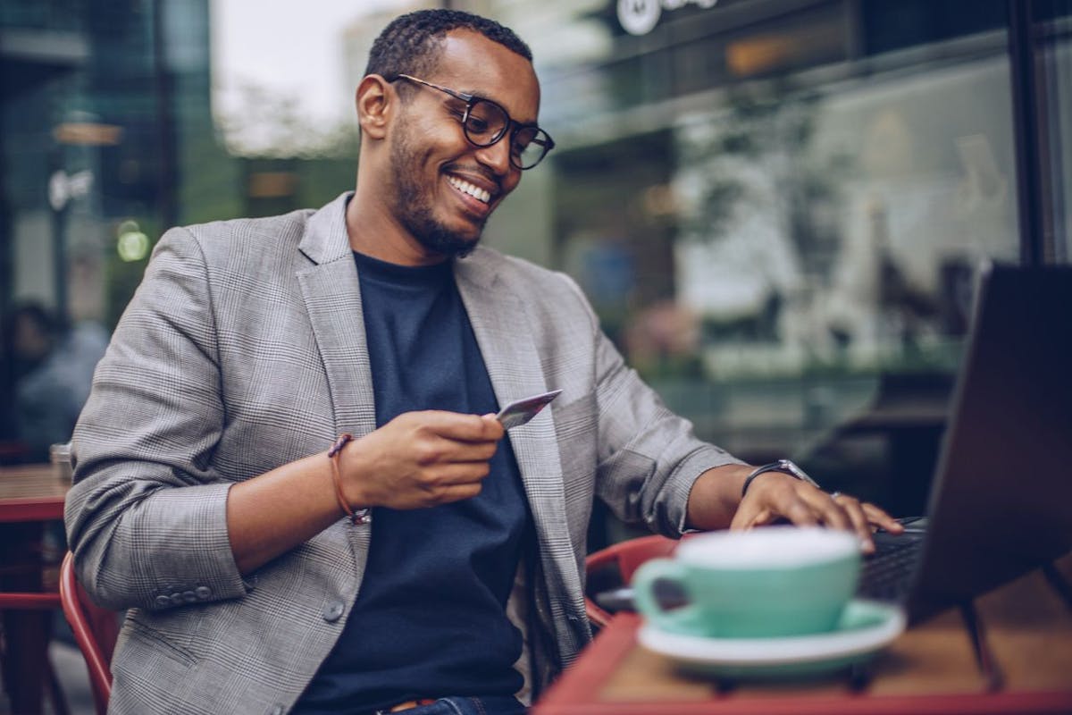 young male professional using corporate card