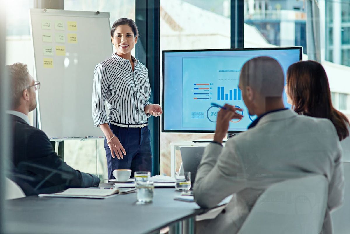 woman presenting at a meeting