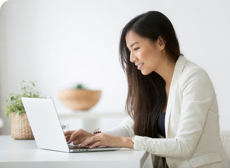 Happy person focused on computer