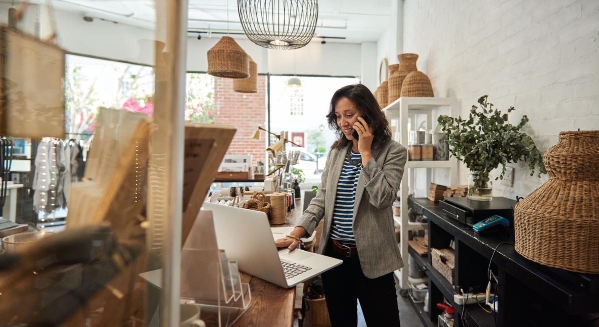 Small business owner making payments on a laptop