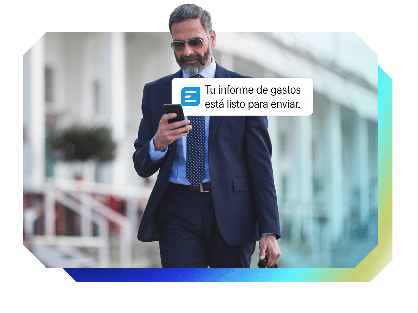 Man in a suit viewing a "Your expense report is ready to send" notification on his smartphone.