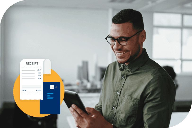 a man is smiling while looking at a receipt on his phone using Emburse Receipt Scanning app