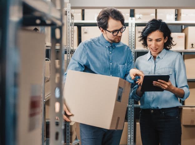 Two people using Emburse API