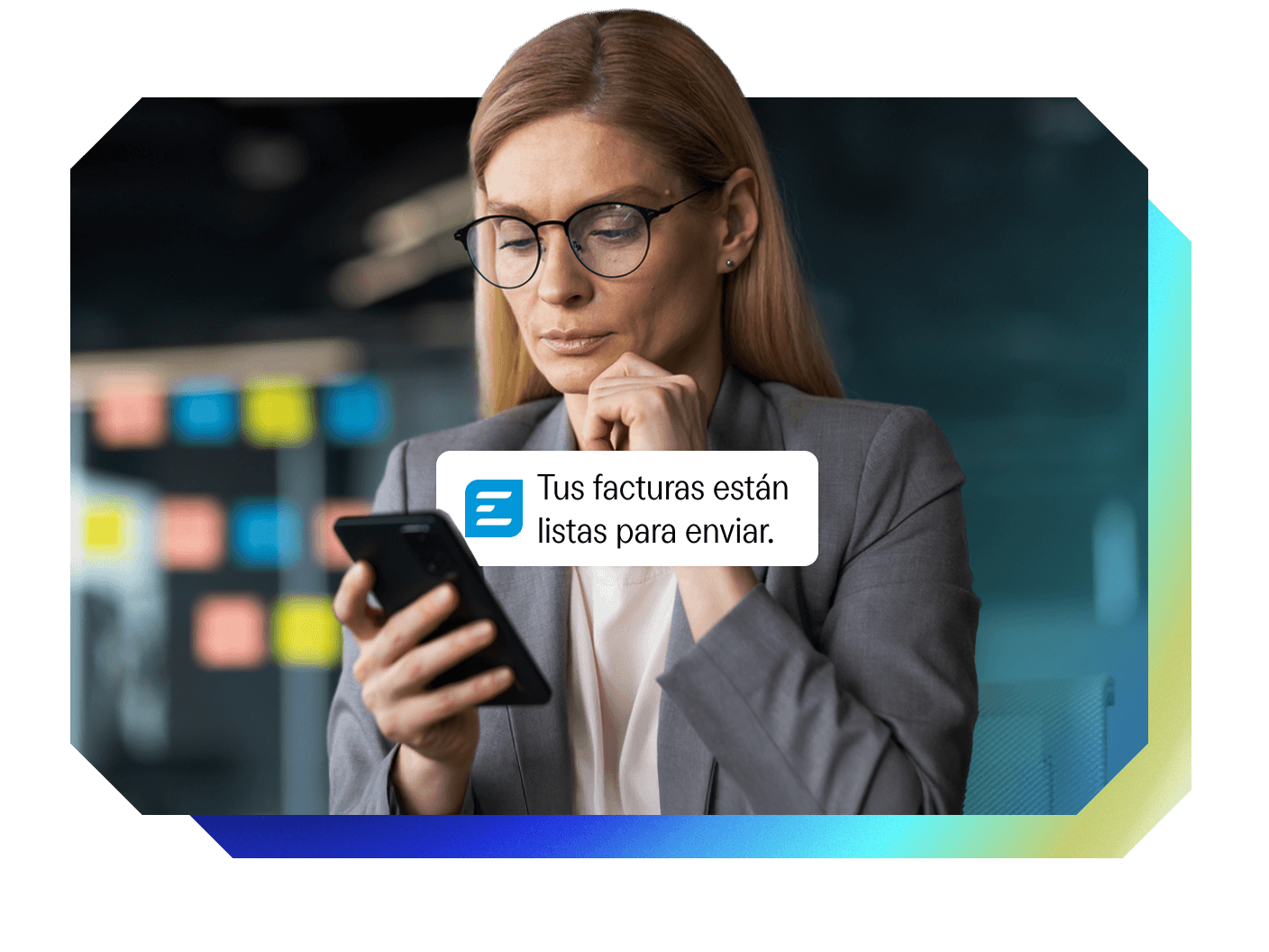 Woman looking at her phone with a notification: "Your invoices are ready to send."