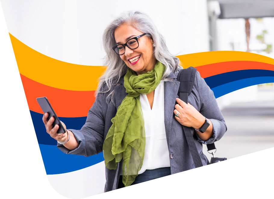 Happy person using their expense management software on their mobile device on the go